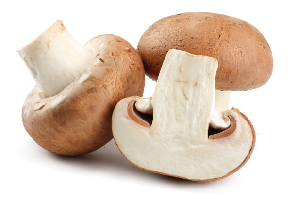istock Fresh champignon mushrooms isolated on white background 898895230