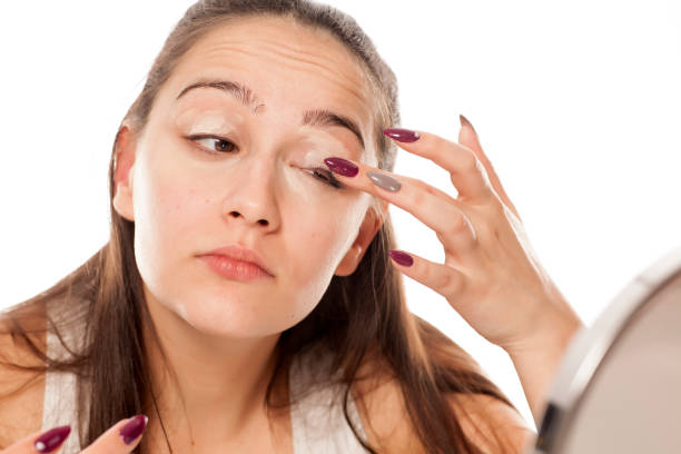 istock young beautiful woman applied base to eyeshadows 898901688