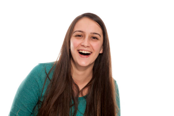 istock Smiling young woman on a white background 898902728