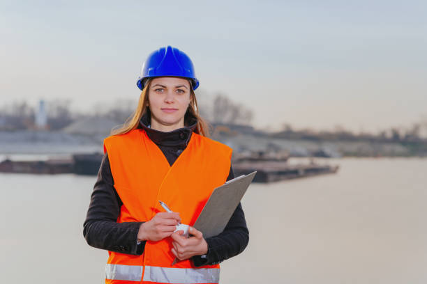 istock Freight transportation industry - Engineer working on inland waterways improvement 898906596