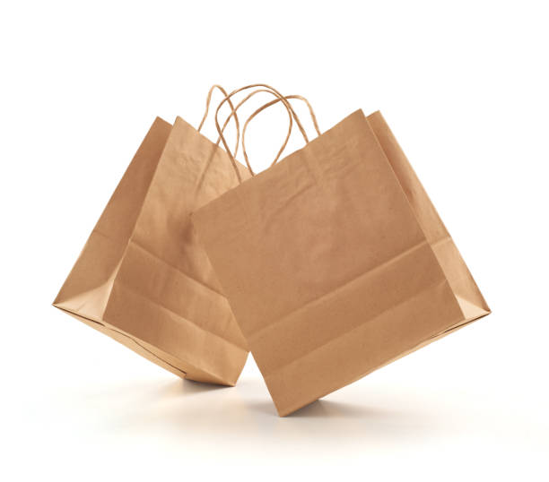 白い背景の上ショッピング バッグ茶色のクラフト ペーパー - paper bag bag brown handle ストックフォトと画像