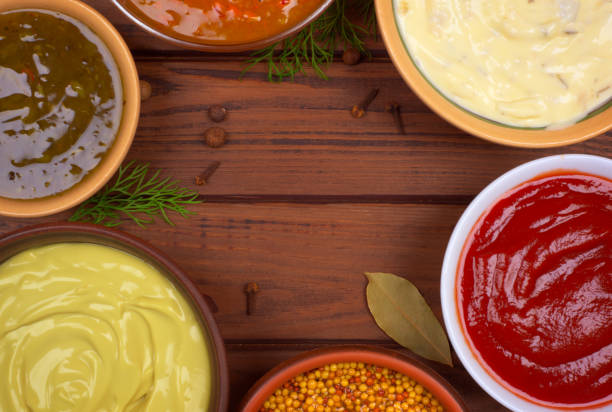 istock bowls with sauces on a wooden background, top view 898907406
