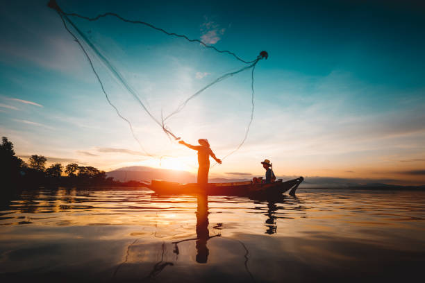 istock Silhouette of fishermen 898907452