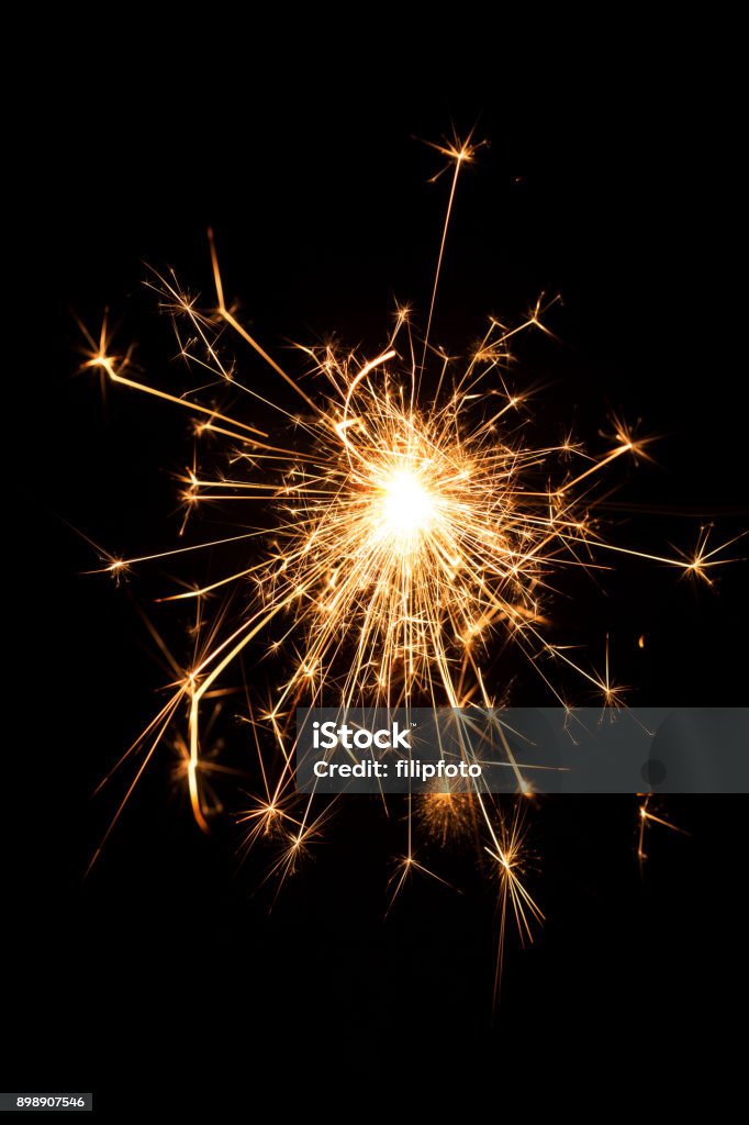 Burning sparkler isolated on black background Sparkler - Firework Stock Photo