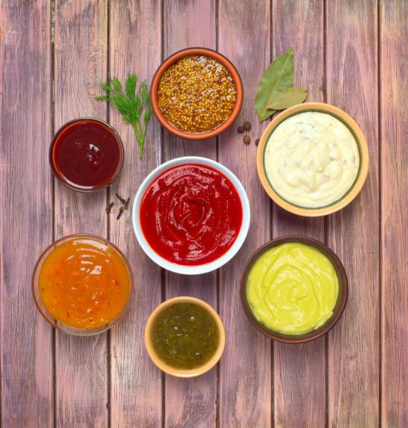 istock sauces set on a wooden background, top view 898907738