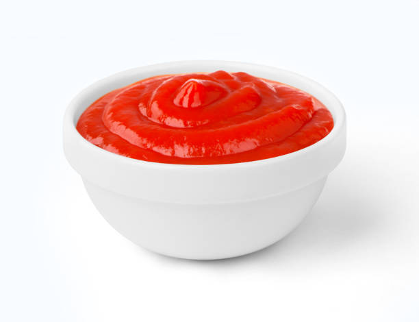 istock ketchup in a bowl on a white background 898907898