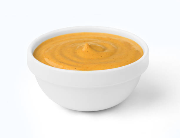 istock mustard in a bowl on a white background 898907904