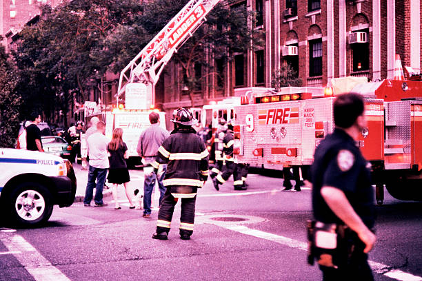 Firemen, Police, and Onlookers - New York City Emergency  police and firemen stock pictures, royalty-free photos & images