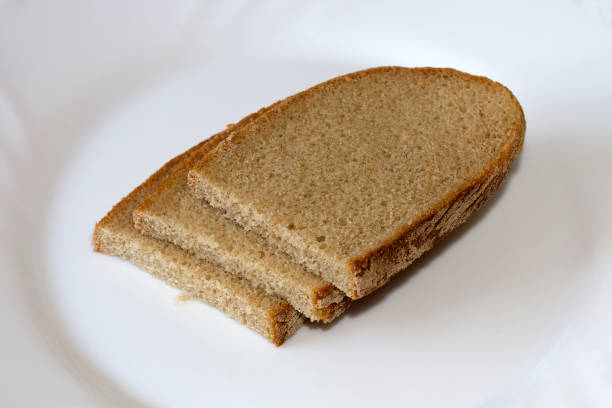 chleb. kromka chleba - loaf of bread bread portion 7 grain bread zdjęcia i obrazy z banku zdjęć
