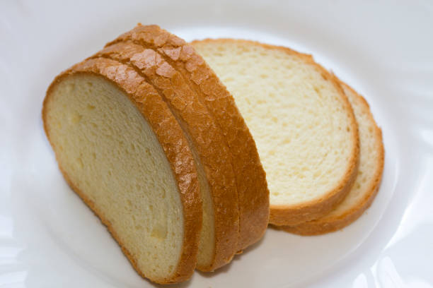 biały chleb. kromka chleba - loaf of bread bread portion 7 grain bread zdjęcia i obrazy z banku zdjęć