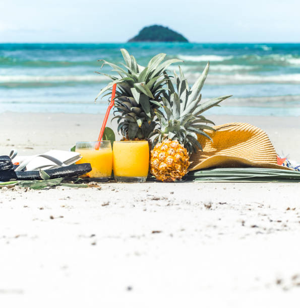 istock summer drinks with fruit on the beach, exotic still life 898920712