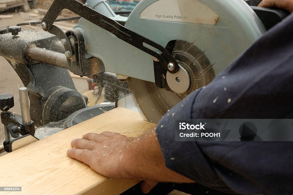 carpenter hand and  saw  Activity Stock Photo