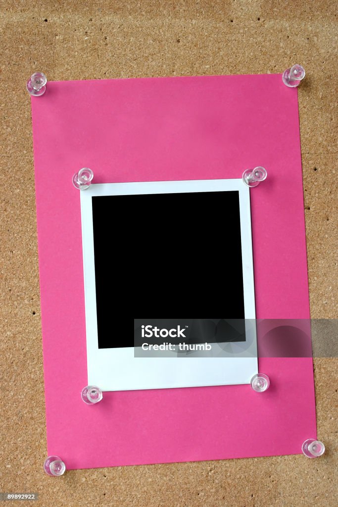 photo frame thumbtacked to cork board  Advice Stock Photo