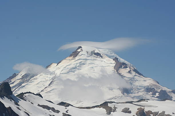 Lenticular cloud cap over Mt. Baker stock photo