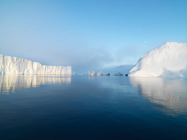 istock Sunset on Arctic Icebergs on Arctic Ocean in Greenland 898932372
