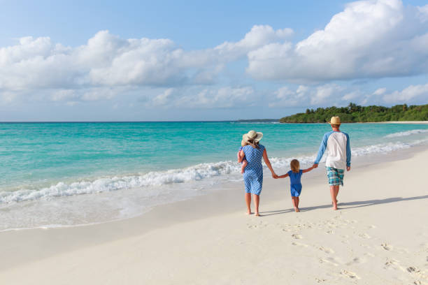 istock happy family with two kids walk on beach 898932754