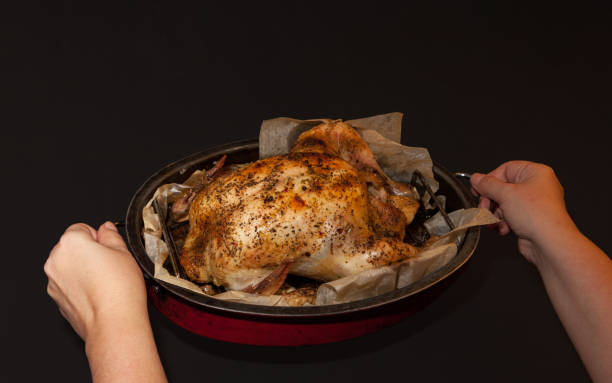istock Baked chicken on dark background 898933624