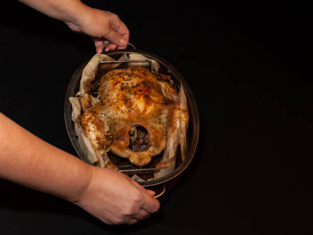 istock Baked chicken on dark background 898933630