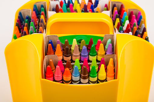 Many Colorful Crayons in Yellow Caddy