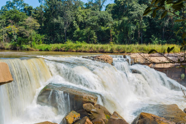 istock Beautiful waterfall in green forest in jungle in the mountain 898937262