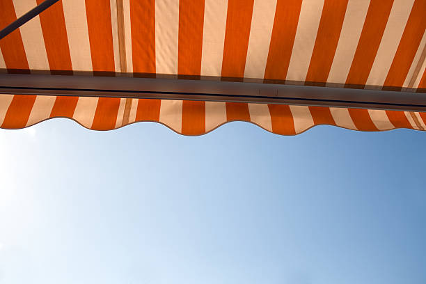 istock A picture looking upwards at a striped awning 89893826