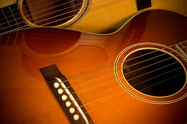 two acoustic guitars stock photo