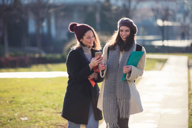 istock Happy Female Students In Public Park 898941352