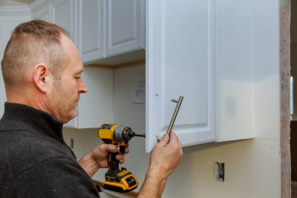 istock installation of door handles on kitchen cabinets with a screwdriver 898942298