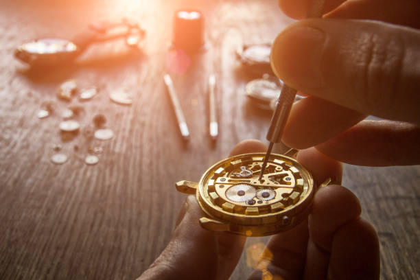 Mechanical watch repair Watchmaker is repairing the mechanical watches in his workshop clockworks photos stock pictures, royalty-free photos & images