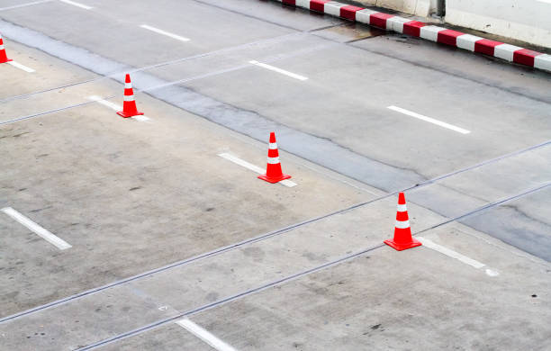 istock Red cones arranged in the street for Traffic. 898951032