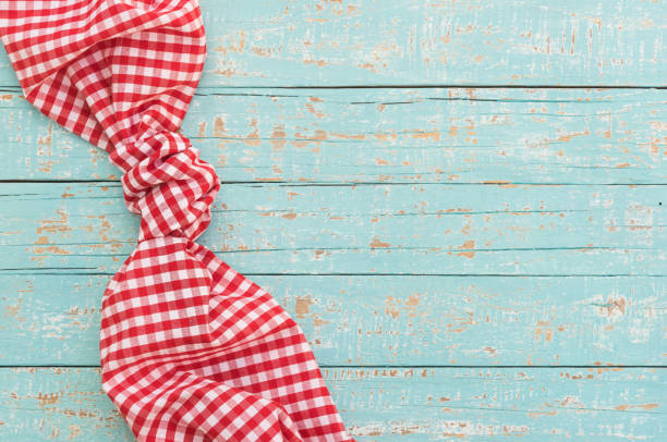 istock Rustic blue wood table background with red napkin 898951442