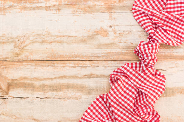 istock Rustic wooden table background with red napkin 898954360