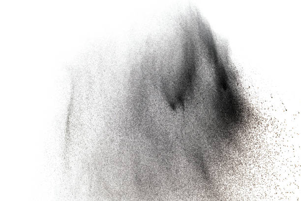 istock Black particles splatter on white background. Black dust splash on white background. 898955328