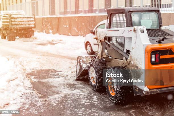 Machine Remove Snow From A City Street Stock Photo - Download Image Now - Snow, Removing, Snowplow