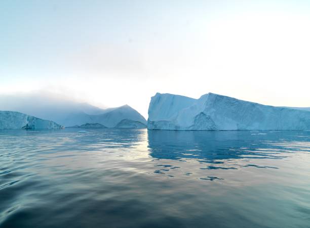 istock Sunset on Arctic Icebergs on Arctic Ocean in Greenland 898957818