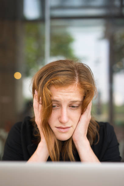 istock Desperate Young Woman Looking at Laptop Screen 898958198