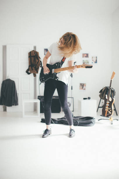 istock Woman playing guitar 898959452