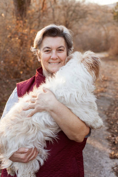 istock senior woman with dog 898959464