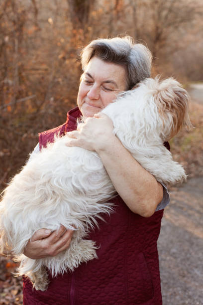 istock senior woman with dog 898962032