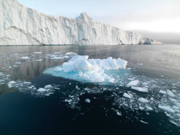 istock Sunset on Arctic Icebergs on Arctic Ocean in Greenland 898963138