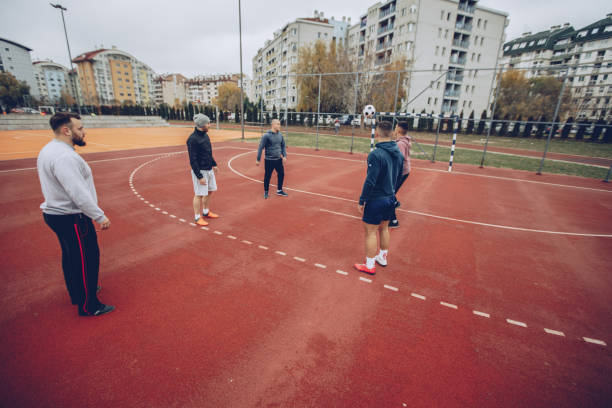 istock Friends on a soccer field 898963322