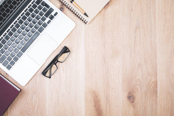 istock Wooden desktop with laptop 898963390