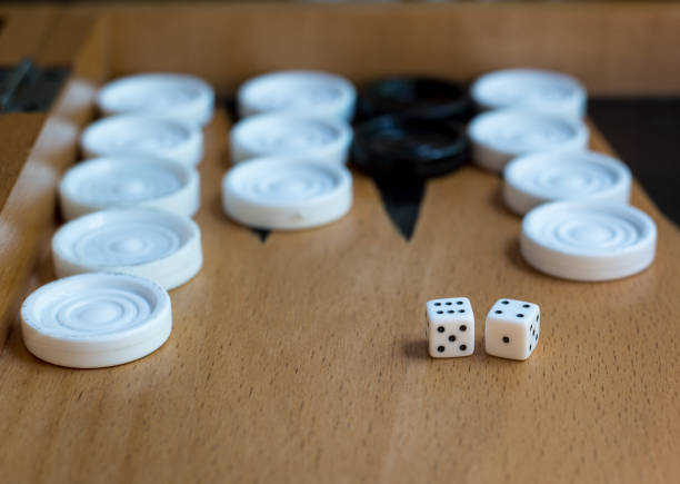 istock Wooden Backgammon board with  slots and dice 898966336