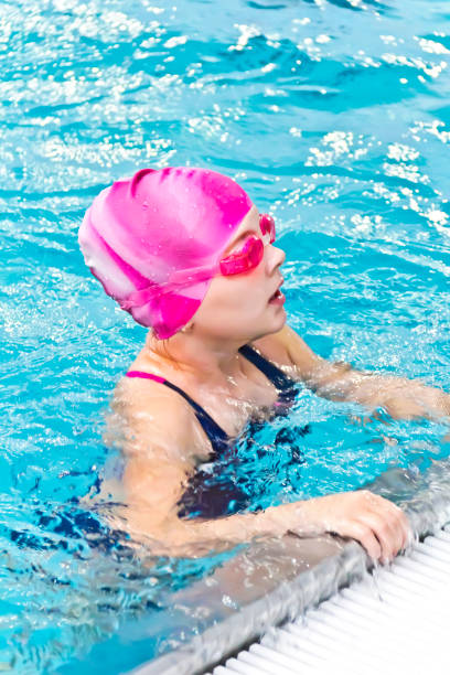 istock Girl in pink rubber hat 898966608