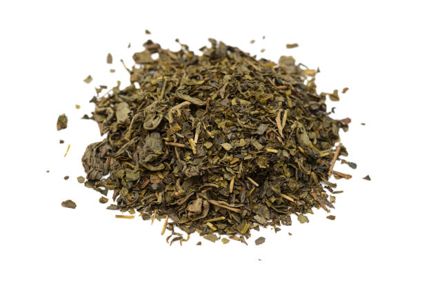 istock handful of dried green tea on a white background 898966802