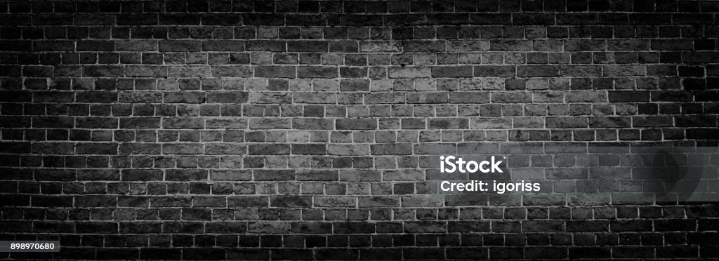 Black Old Brick wall panoramic background in high resolution Black Brick wall panoramic background. High resolution panorama. Aging Process Stock Photo