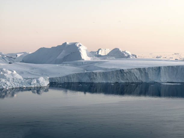 istock Sunset on Arctic Icebergs on Arctic Ocean in Greenland 898971698