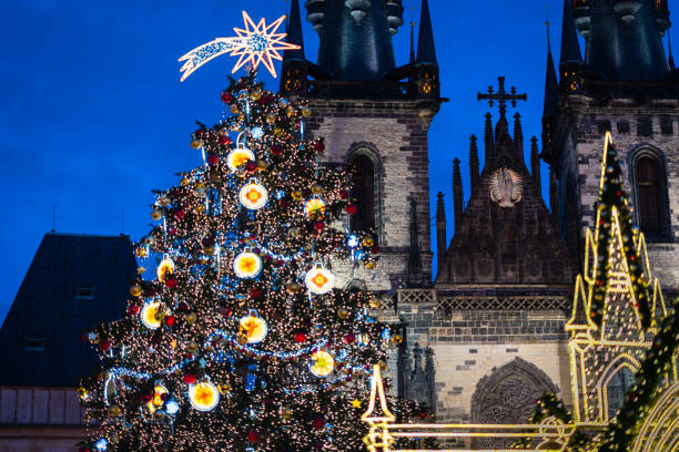 Christmas tree on Prague Old Town Square Prague Christmas tree on Old Town Square in Czech Republic prague christmas market stock pictures, royalty-free photos & images
