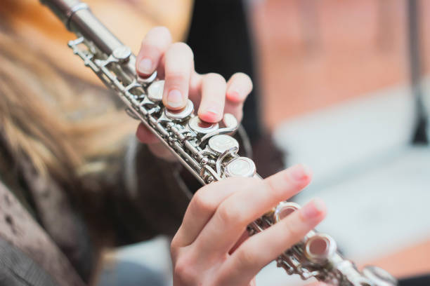 istock A girl plays a flute 898984364