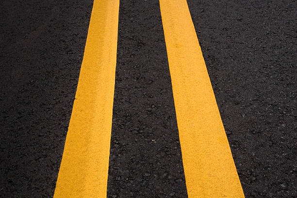 istock Asphalt Road Center Lines Closeup 89898490